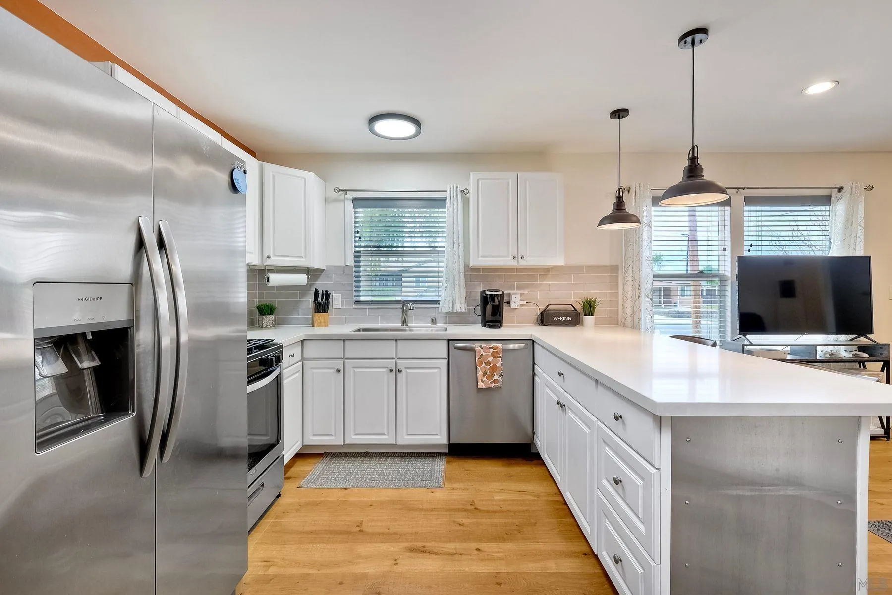 9410 Pike Road Santee, CA 92071 - Photo 11 of 25 a kitchen with stainless steel appliances granite countertop a sink stove and refrigerator