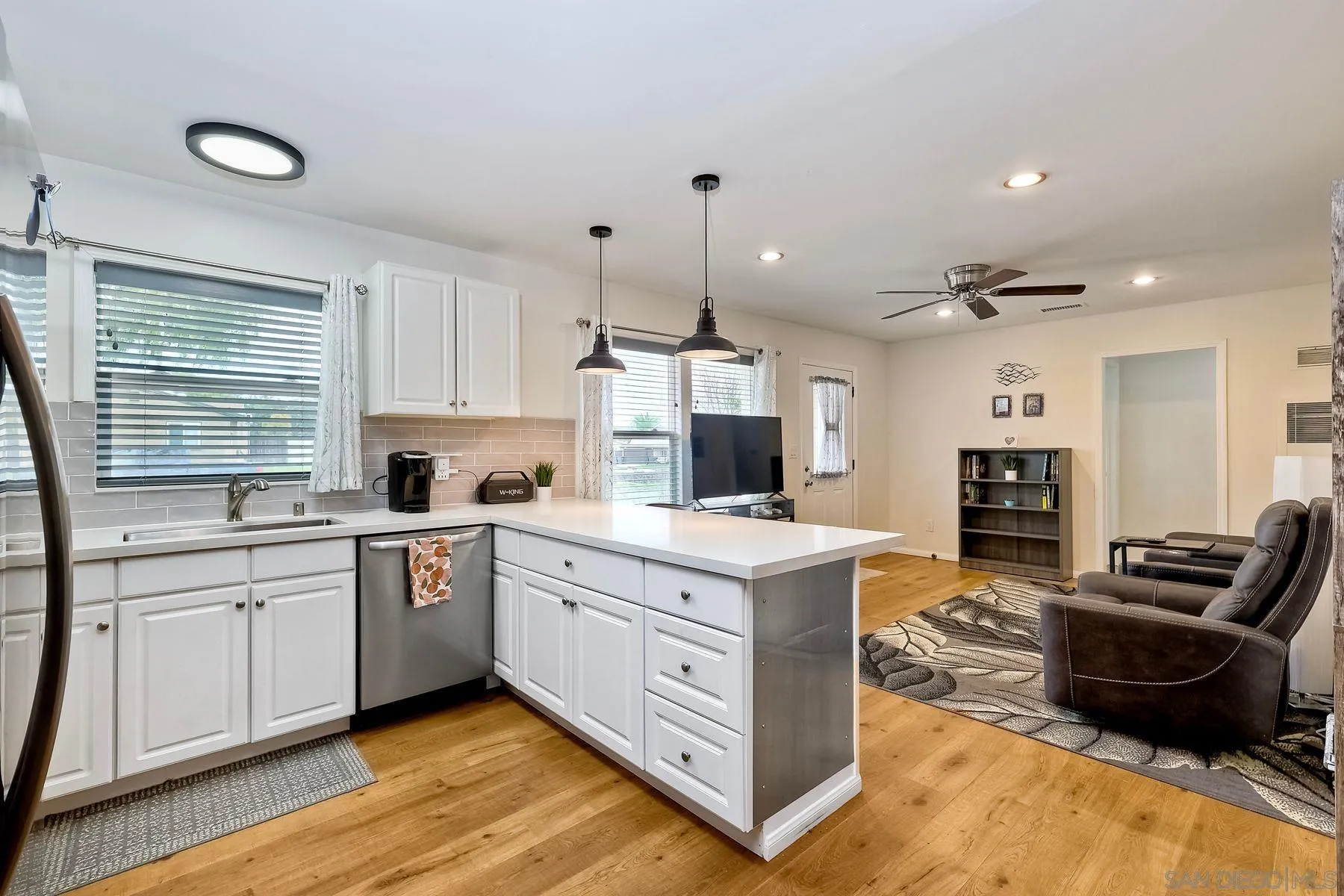 9410 Pike Road Santee, CA 92071 - Photo 15 of 25 a kitchen with a sink stove and refrigerator