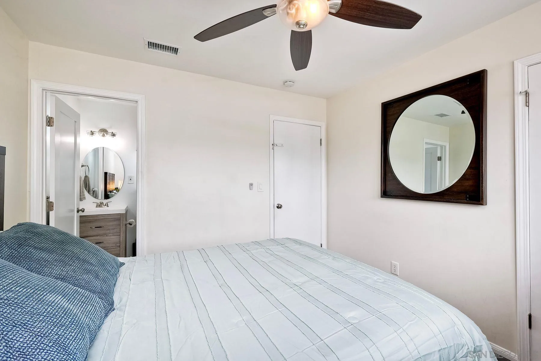 9410 Pike Road Santee, CA 92071 - Photo 17 of 25 a bedroom with a bed and a mirror