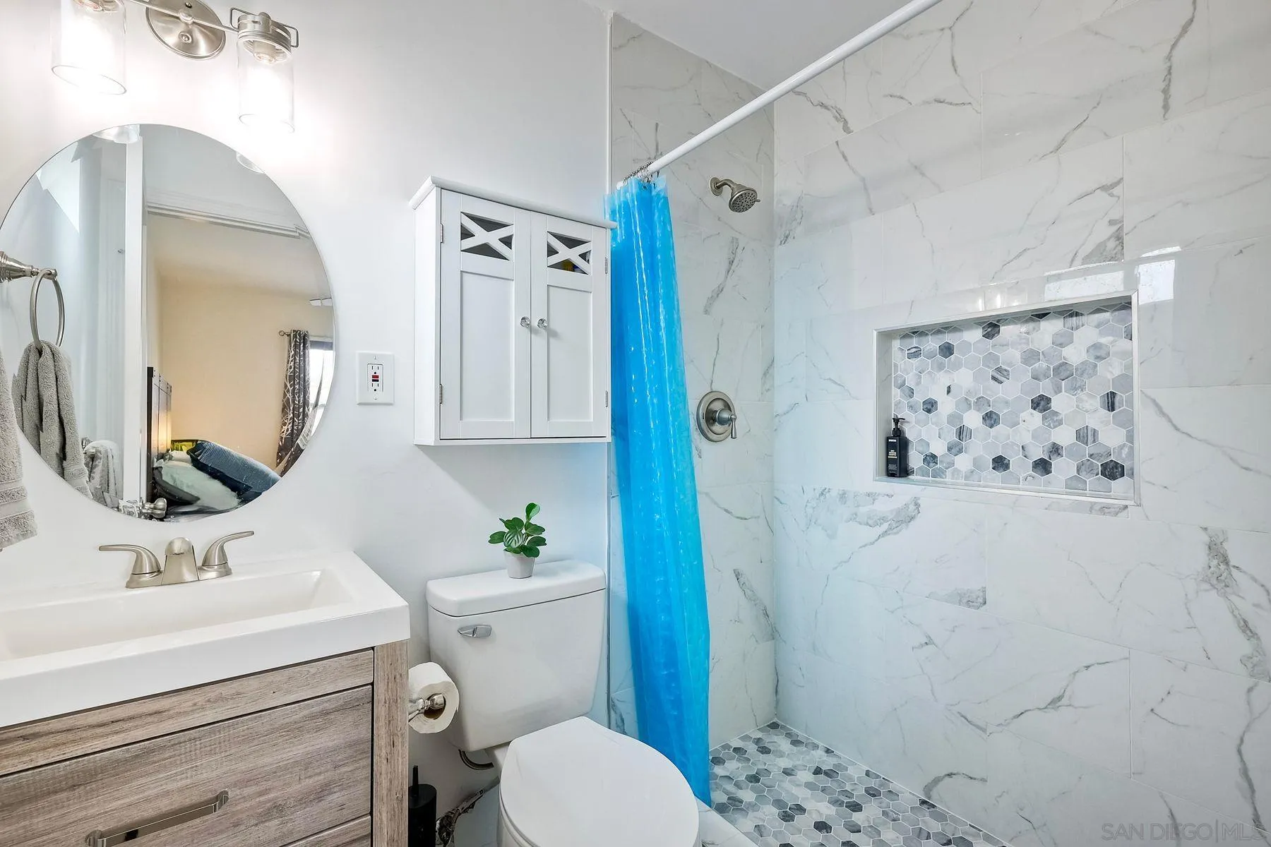9410 Pike Road Santee, CA 92071 - Photo 18 of 25 a bathroom with a sink toilet and shower