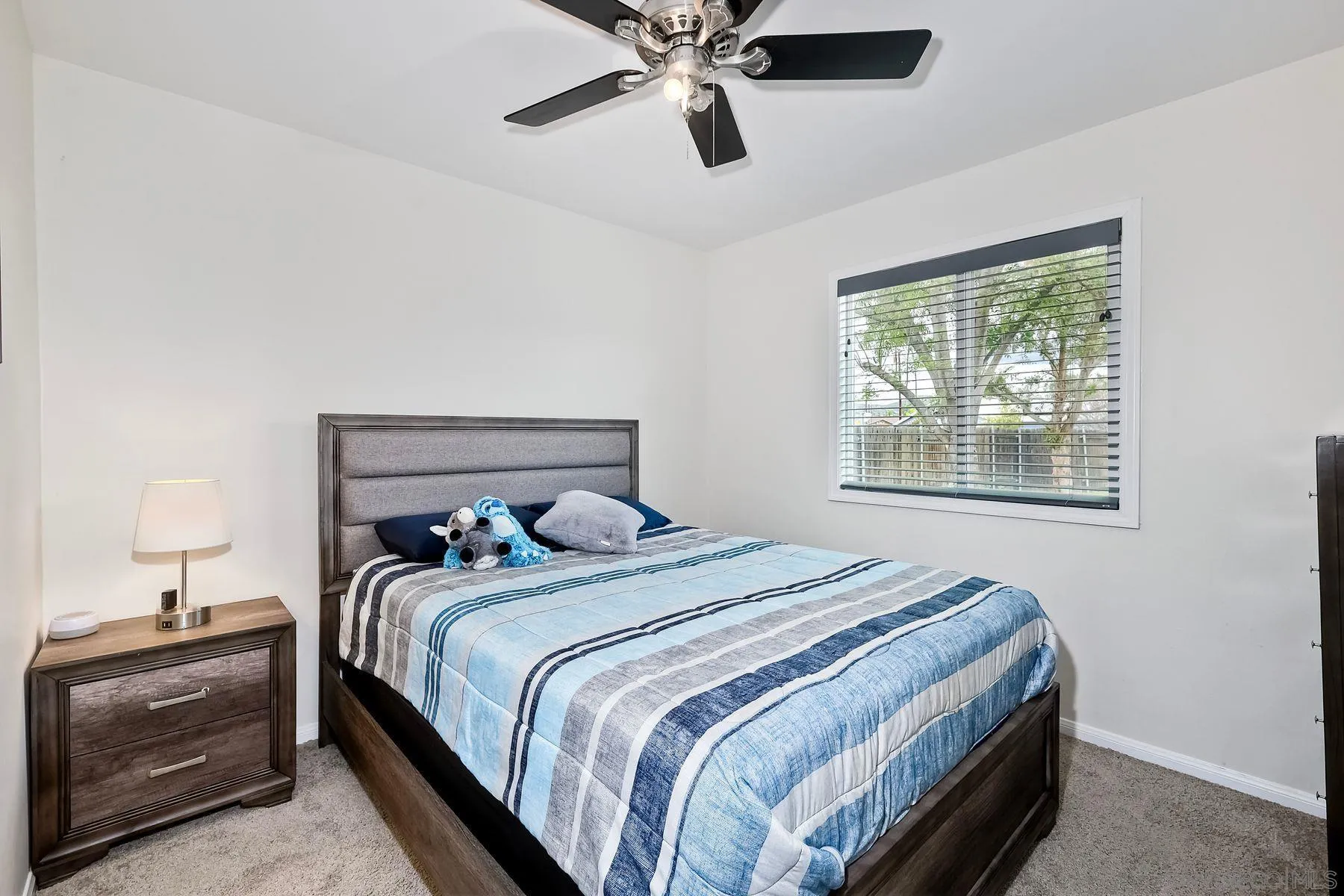 9410 Pike Road Santee, CA 92071 - Photo 19 of 25 a bedroom with a bed and window
