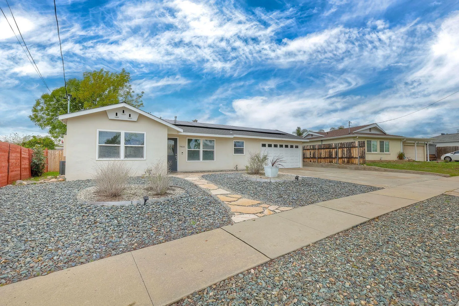 9410 Pike Road Santee, CA 92071 - Photo 2 of 25 a front view of a house with a yard