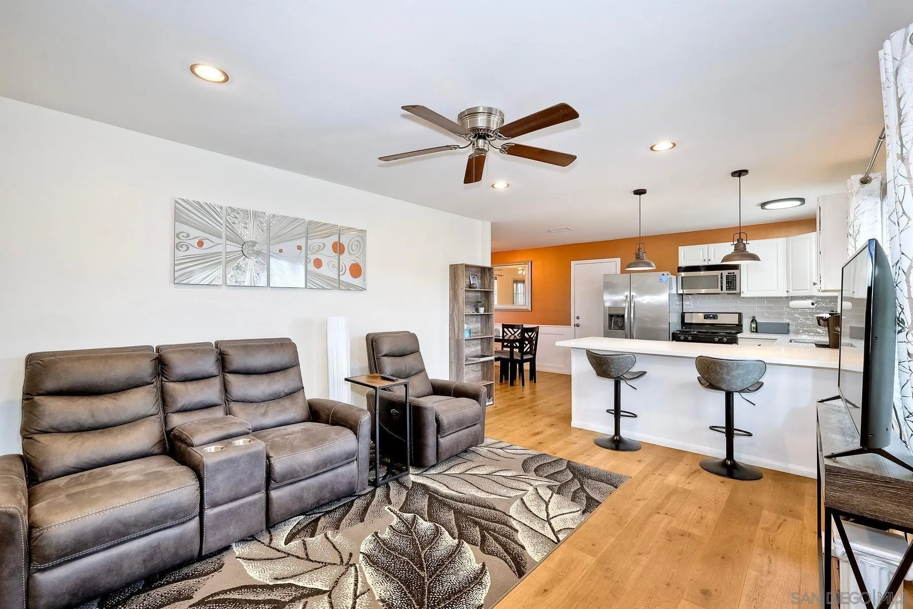 9410 Pike Road Santee, CA 92071 - Photo 5 of 25 a living room with furniture kitchen view and a chandelier