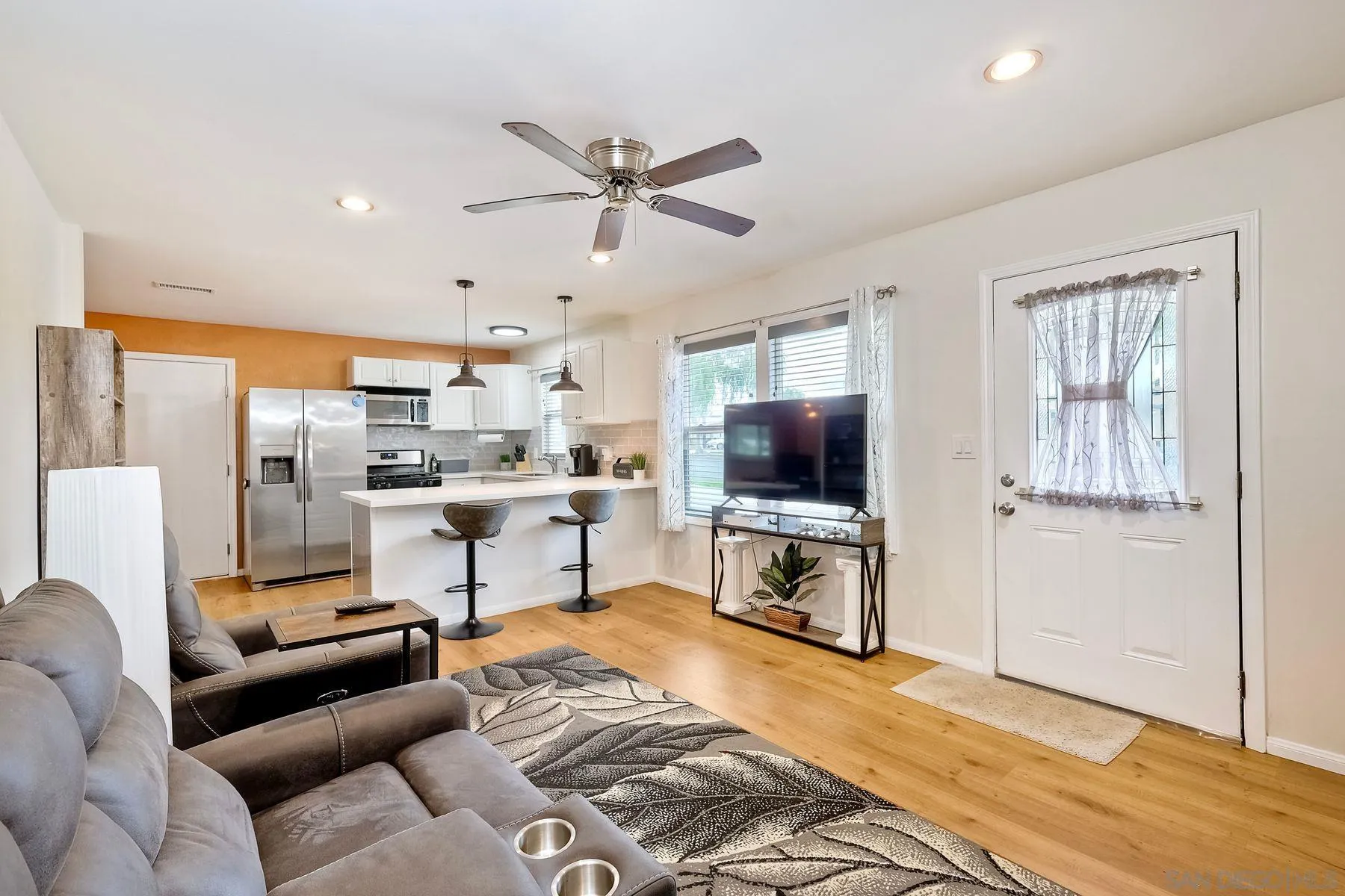 9410 Pike Road Santee, CA 92071 - Photo 6 of 25 a living room with furniture and a flat screen tv