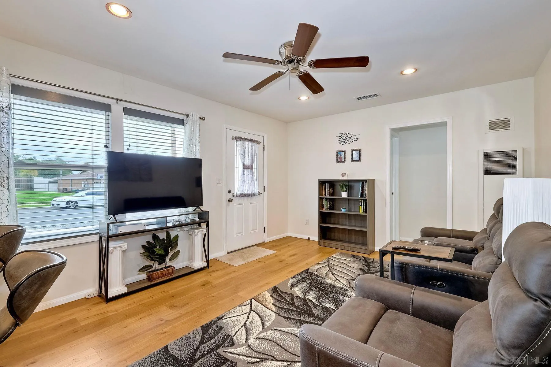 9410 Pike Road Santee, CA 92071 - Photo 7 of 25 a living room with furniture and a flat screen tv