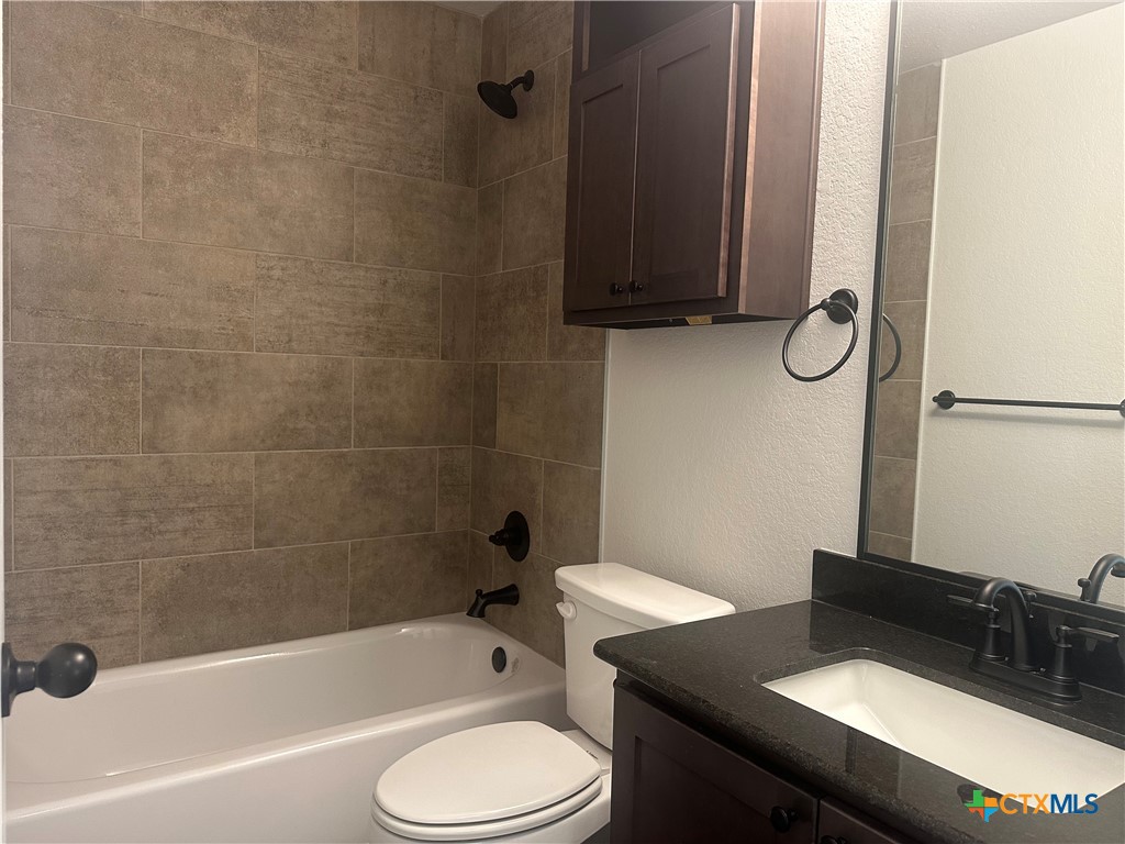 2005 Edna Lane Troy, TX 76579 - Photo 22 of 30 a bathroom with a sink a toilet and bathtub