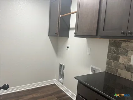 a bathroom with a tub and a sink