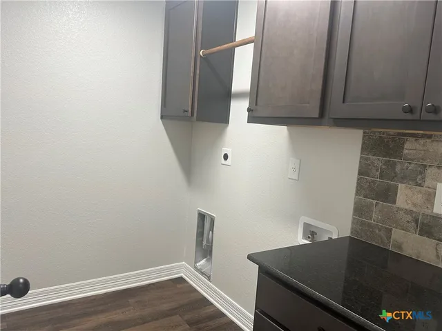 a bathroom with a tub and a sink