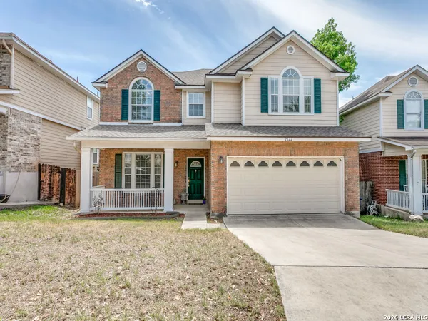 a front view of a house with a garage