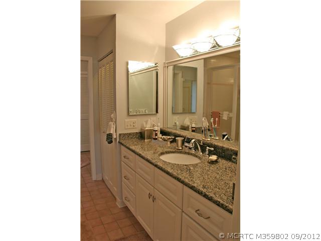 2640 Northwest Collins Cove Road Stuart, FL 34994 - Photo 12 of 21 Master Bath/Spa. Master Bath offers a new vanity and has a large soaking tub plus a walk in shower. The adjacent dressing area offers a mirrored vanity.