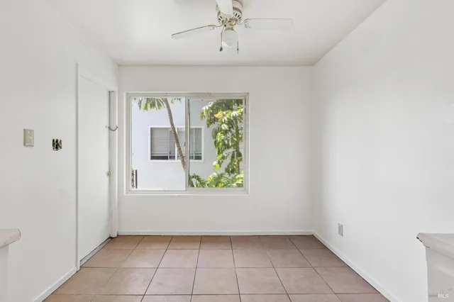 a kitchen with granite countertop a sink stove and refrigerator