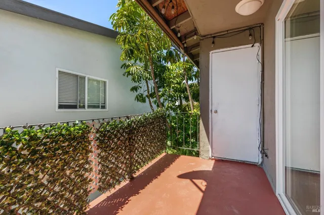 a living room with furniture or couch and a wooden floor