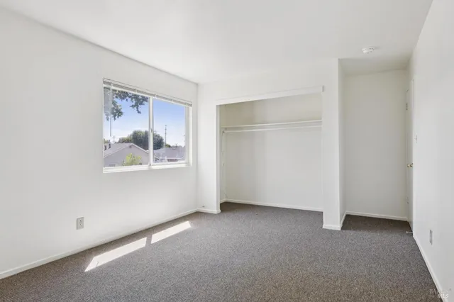 a kitchen filled counter top space a sink a stove and a window