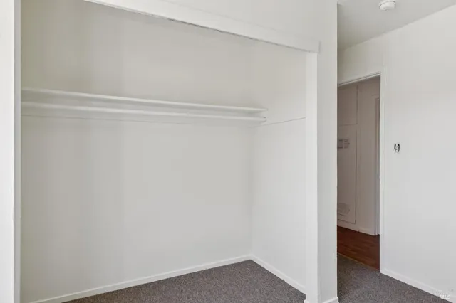 a living room with furniture a rug and a flat screen tv