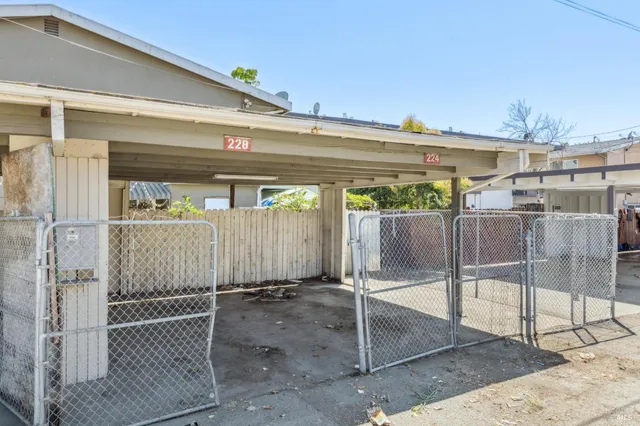 a kitchen with stainless steel appliances granite countertop a sink and a refrigerator