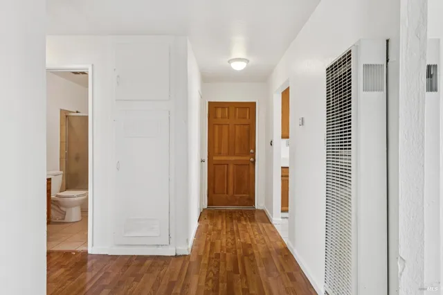a kitchen with stainless steel appliances granite countertop a sink stove and a refrigerator