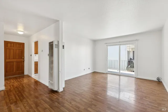 a kitchen with stainless steel appliances granite countertop a sink and a refrigerator
