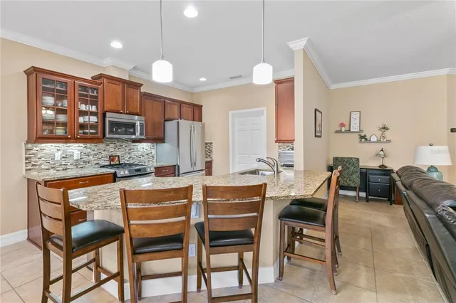 a large kitchen with a table and chairs