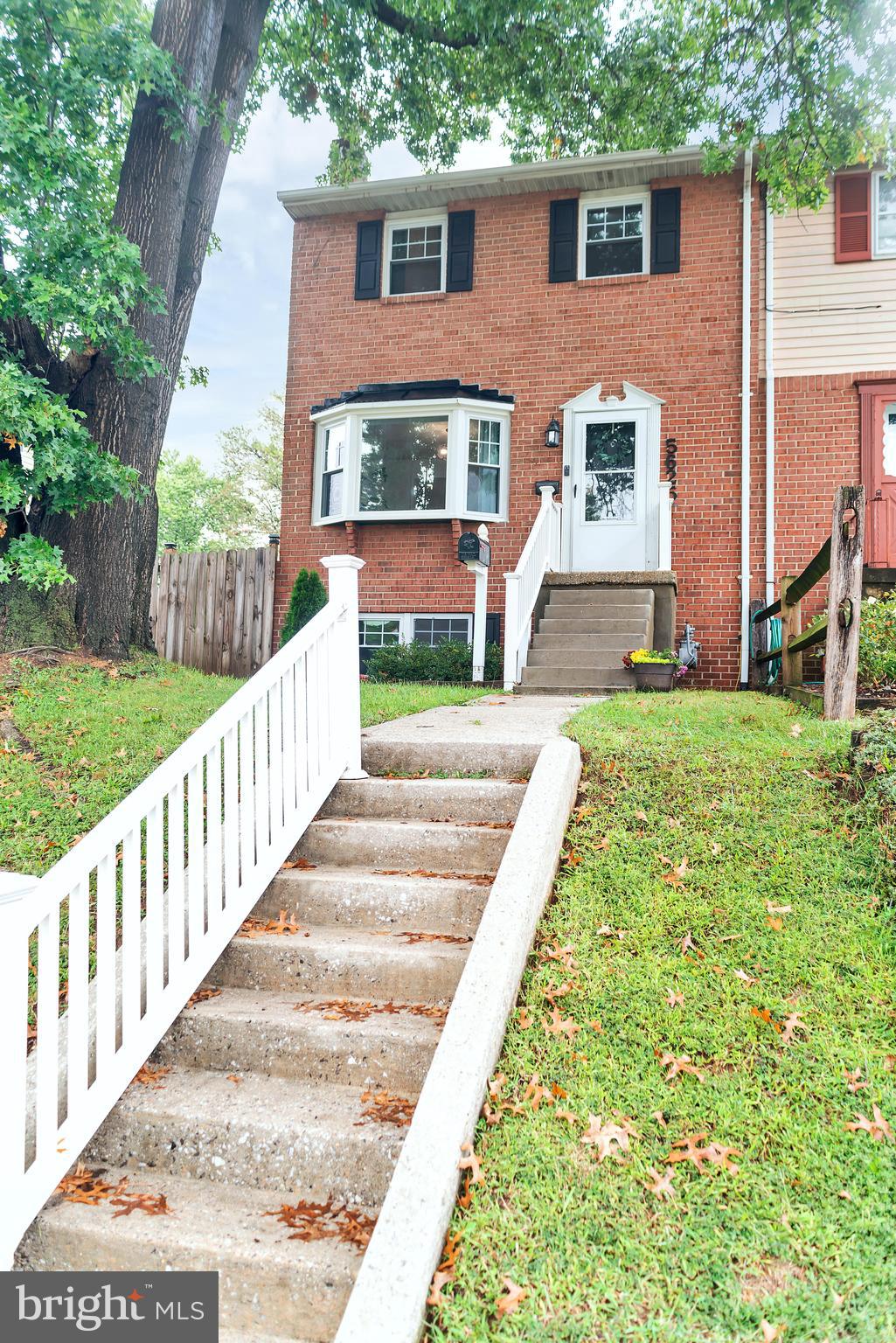 5625 Selford Road Halethorpe, MD 21227 - Photo 1 of 52 a front view of a house with a yard table and chairs