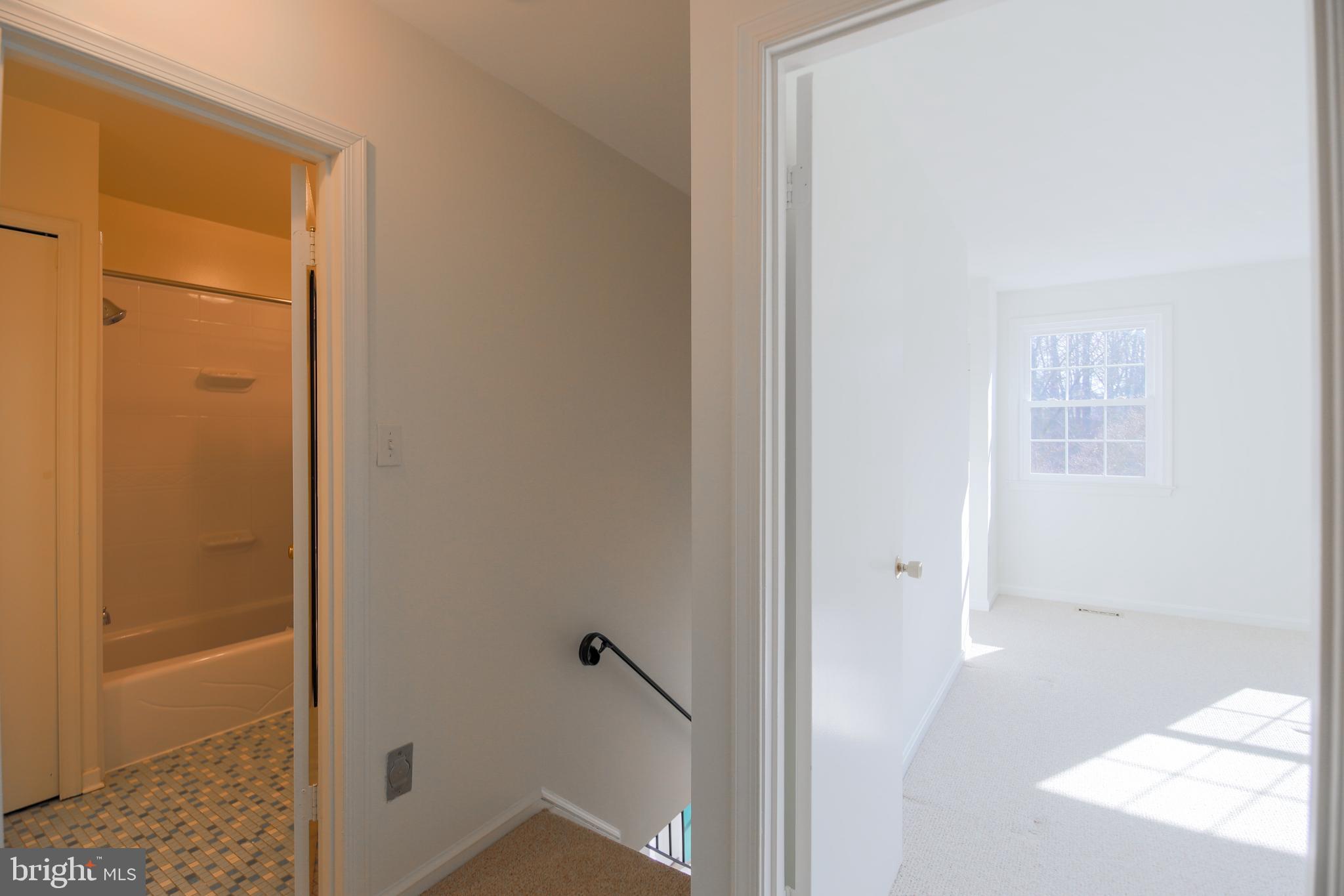 9738 Cardinal Road Fairfax, VA 22030 - Photo 31 of 63 View of Hall Bath & Primary Suite at Top of Stairs