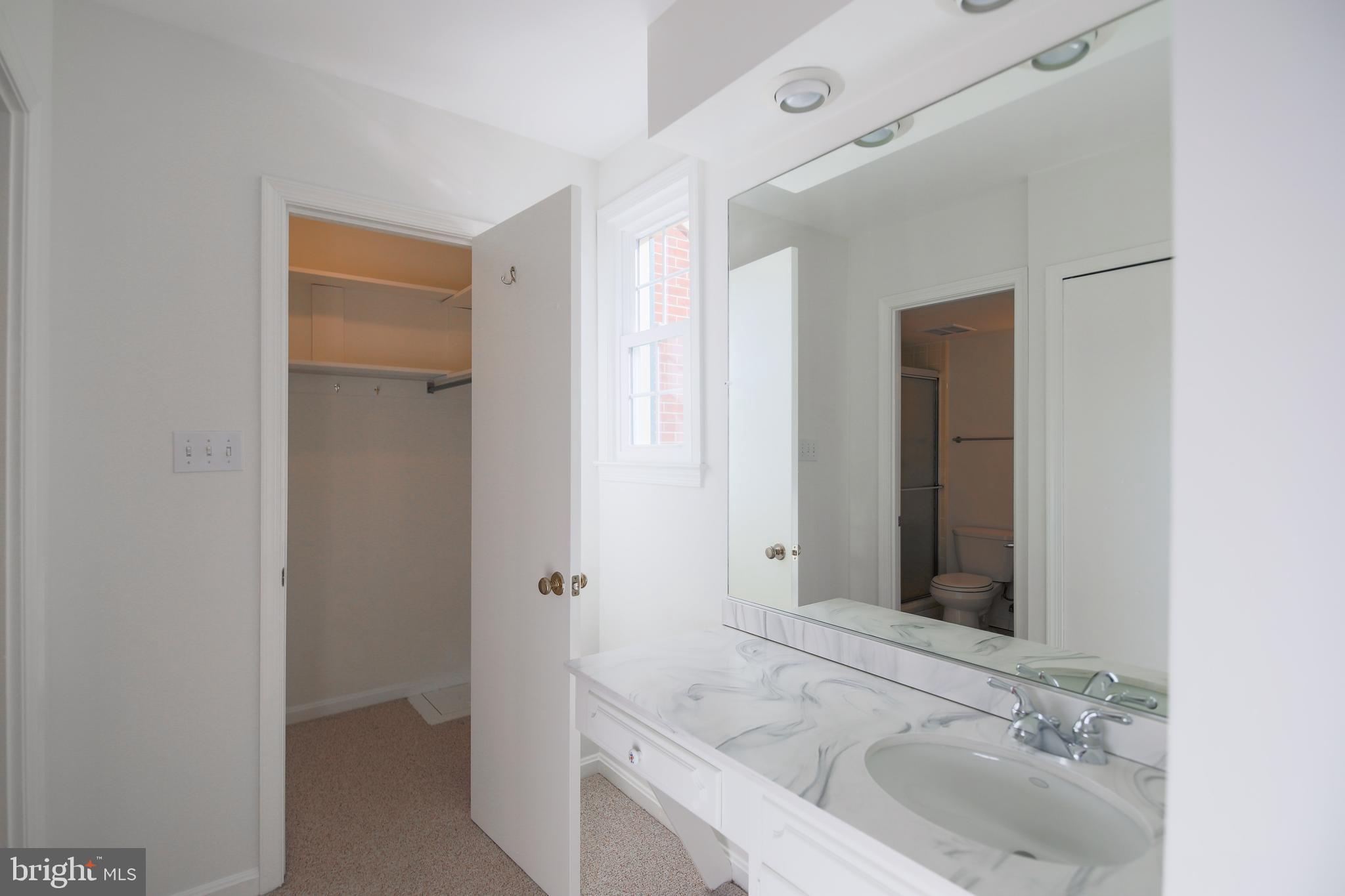 9738 Cardinal Road Fairfax, VA 22030 - Photo 36 of 63 Walk-In Closet & Vanity in Primary Bedroom
