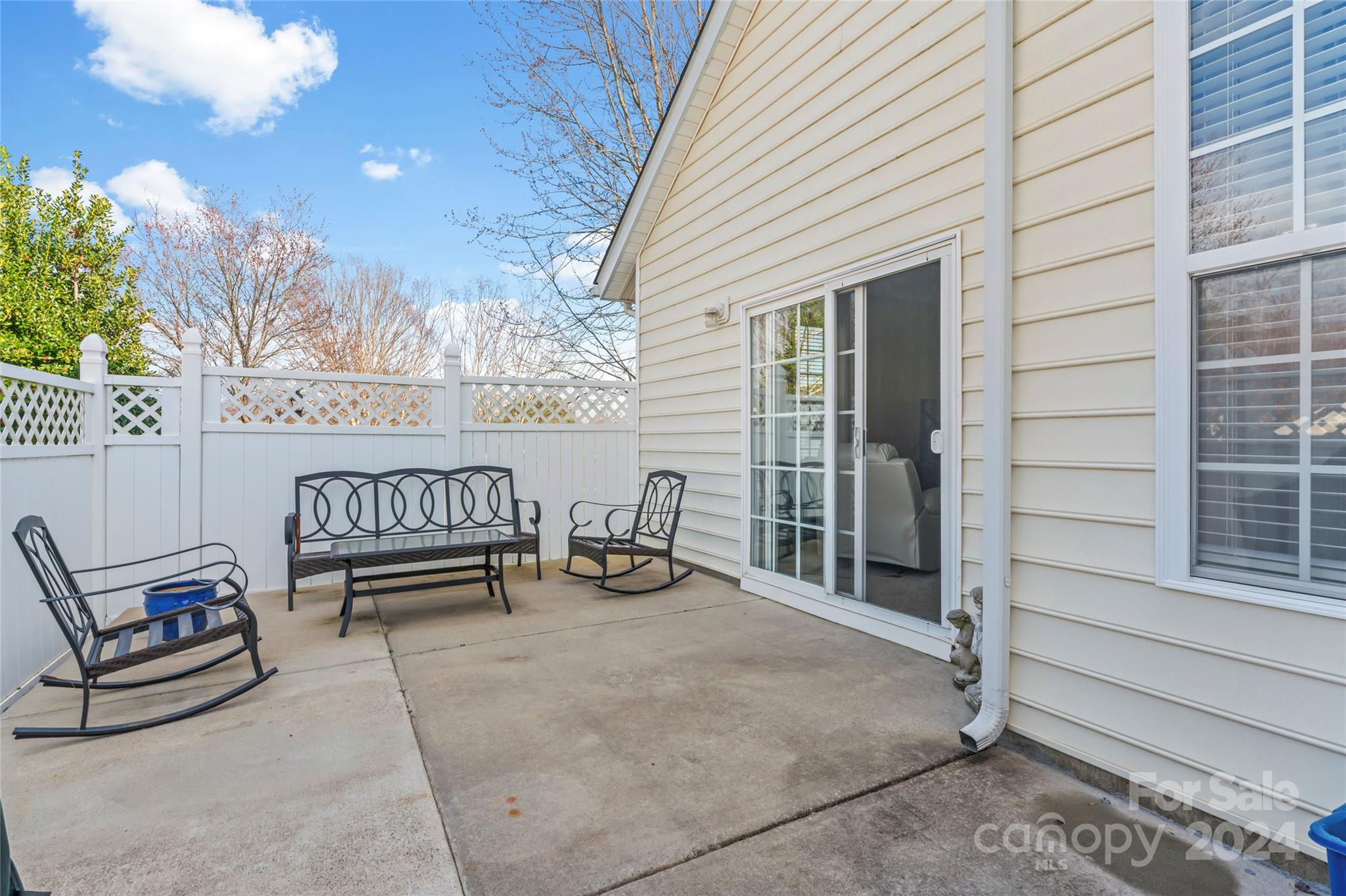 806 Gentlewinds Court Fort Mill, SC 29708 - Photo 7 of 37 a view of a chairs and table in the back yard of the house