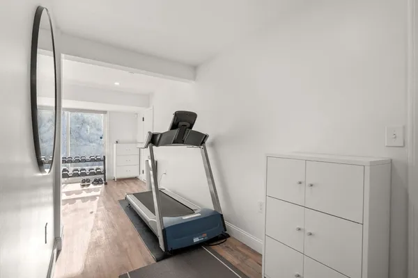 a room with lots of chairs and mirrors