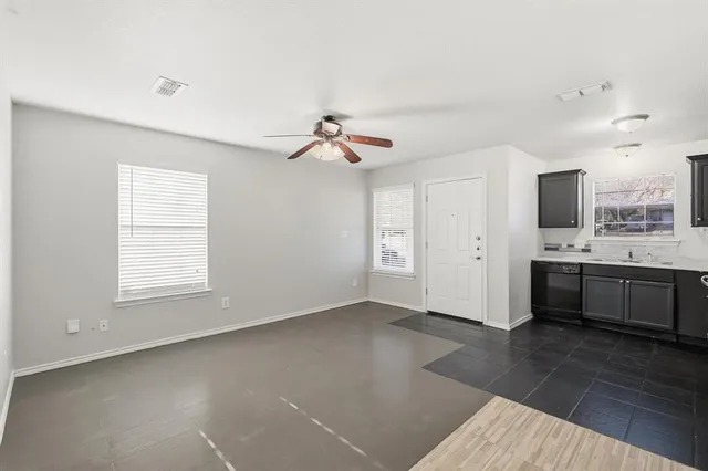 a view of a kitchen with a sink and cabinet