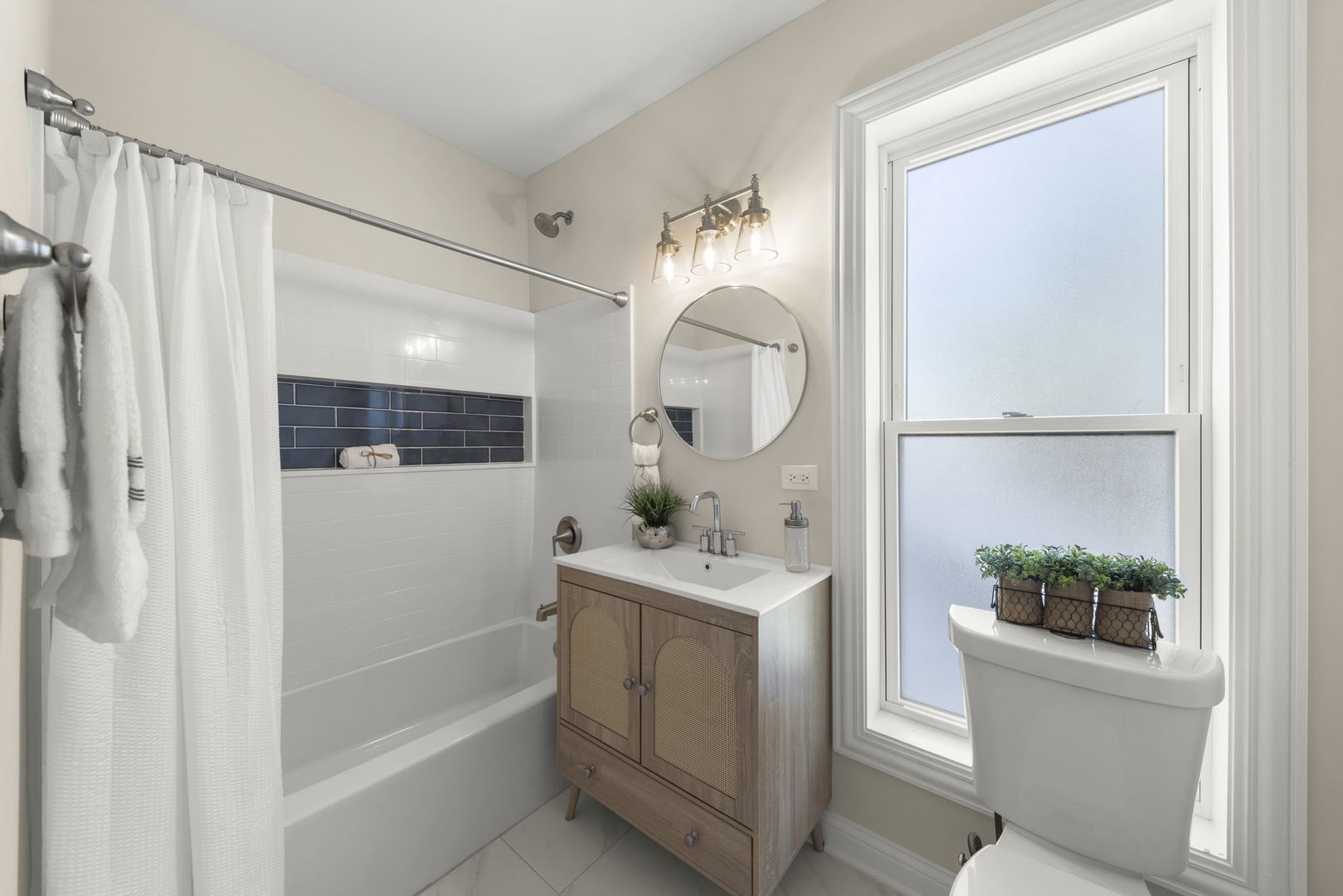 1280 Brandywine Circle Batavia, IL 60510 - Photo 22 of 36 a bathroom with a sink a mirror a vanity and a shower