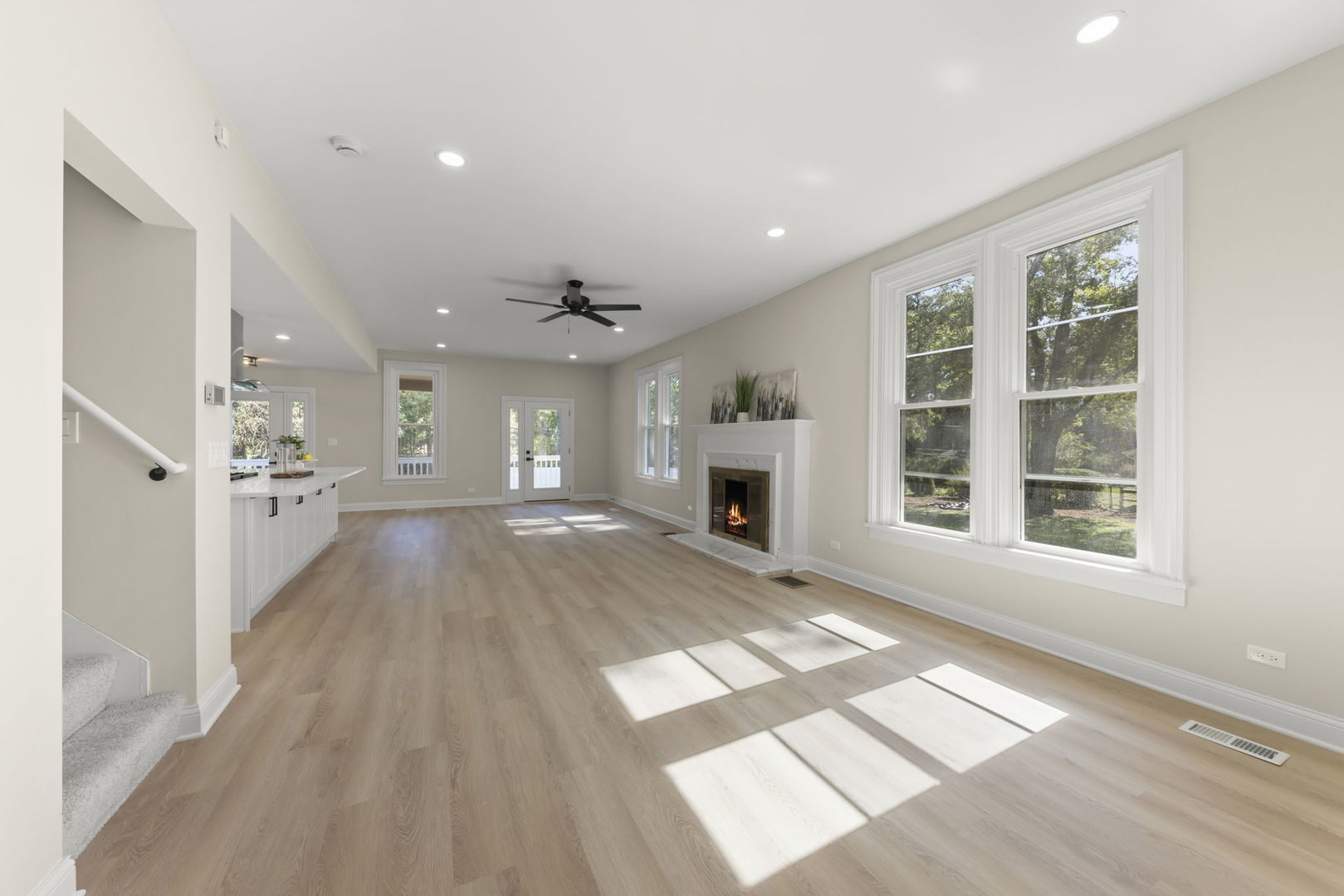 1280 Brandywine Circle Batavia, IL 60510 - Photo 3 of 36 a view of an empty room with wooden floor and a window