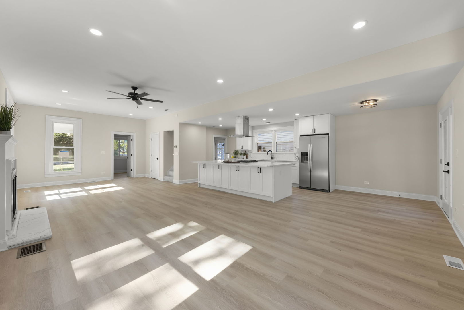 1280 Brandywine Circle Batavia, IL 60510 - Photo 6 of 36 a view of a kitchen with a sink and a refrigerator