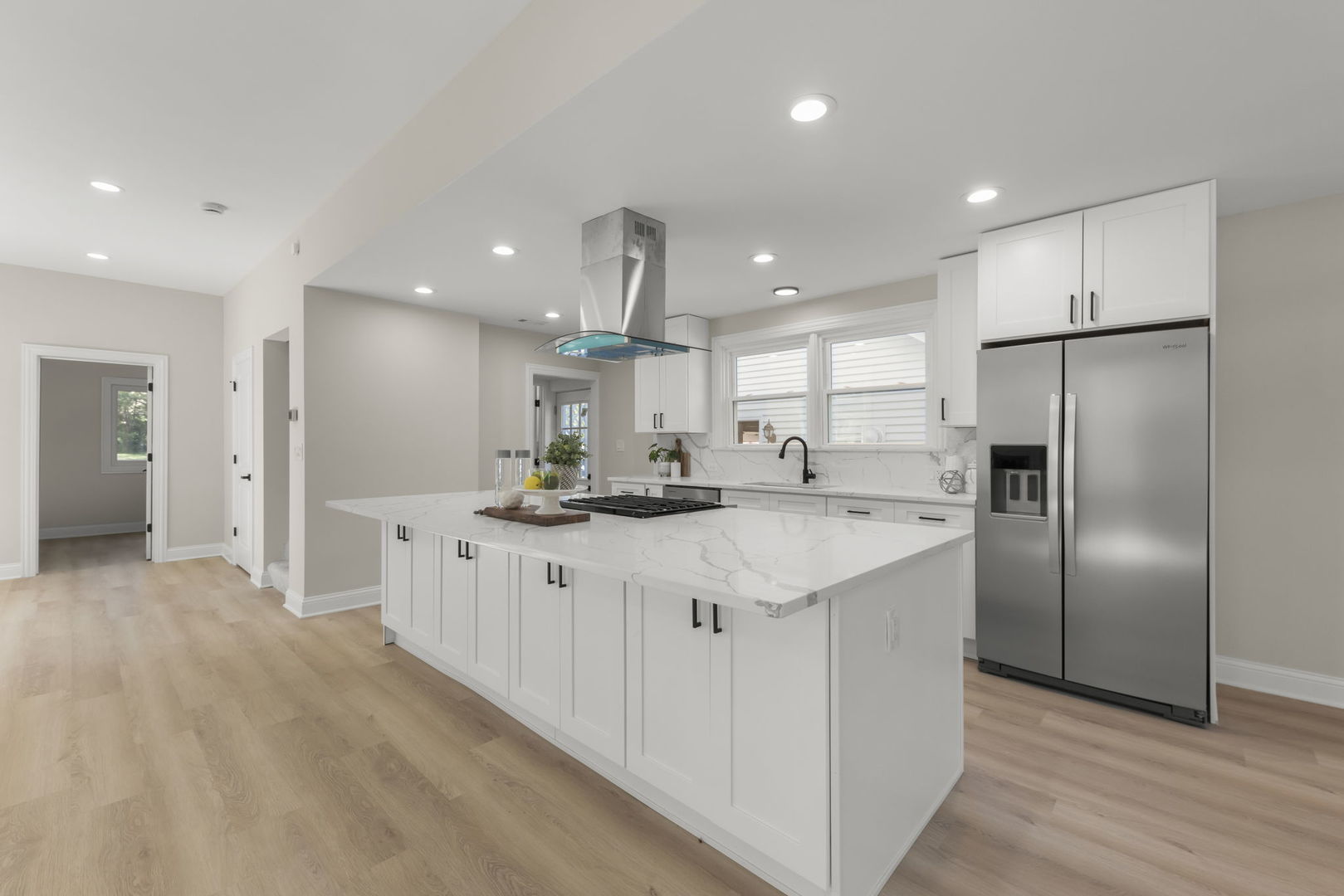 1280 Brandywine Circle Batavia, IL 60510 - Photo 8 of 36 a large kitchen with stainless steel appliances kitchen island a large counter top and a refrigerator