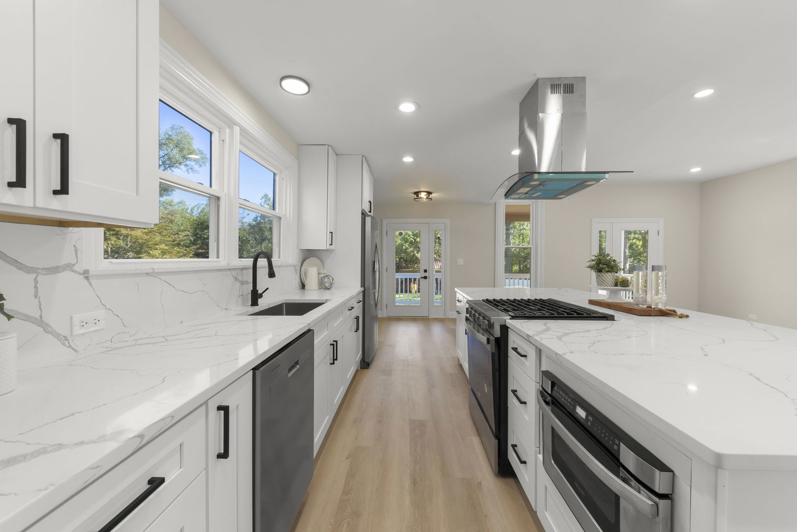 1280 Brandywine Circle Batavia, IL 60510 - Photo 9 of 36 a kitchen with stainless steel appliances granite countertop a sink a stove and a wooden floors