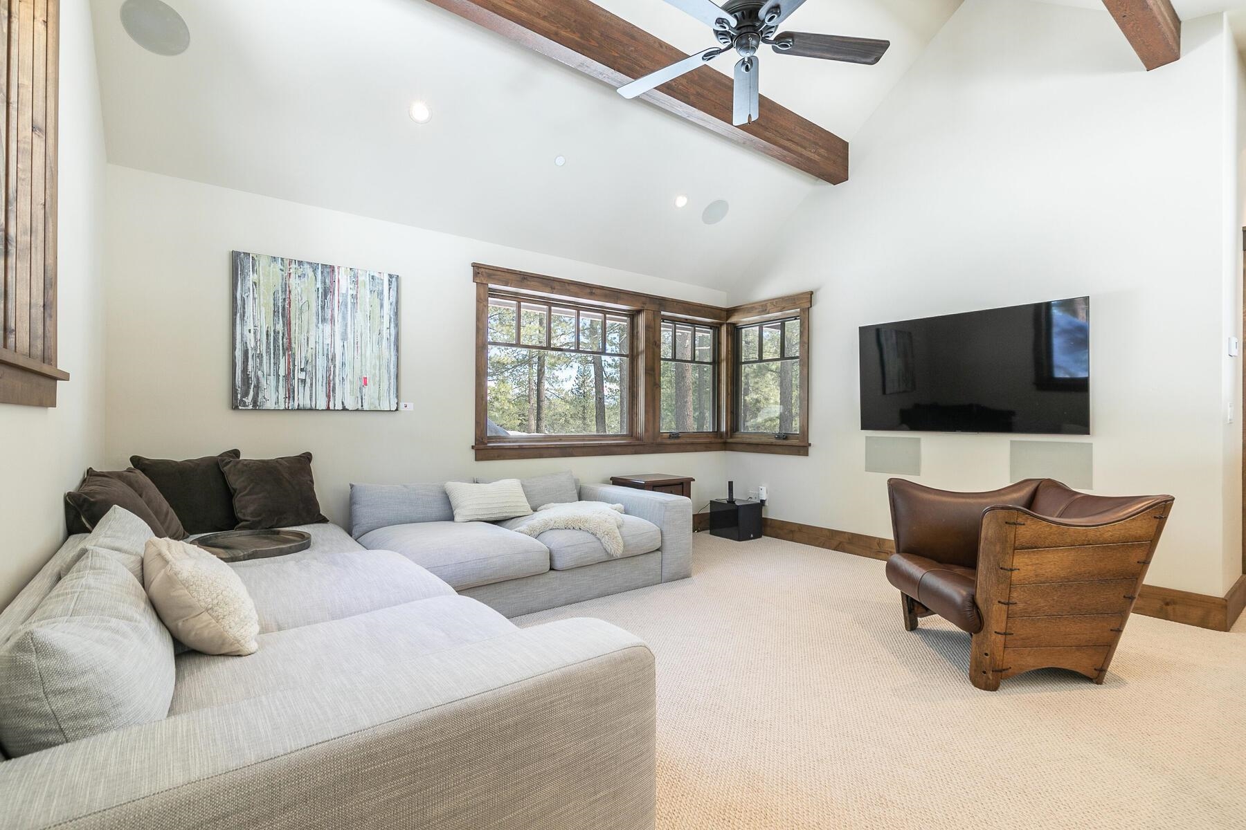 11478 Henness Road Truckee, CA 96161 - Photo 11 of 21 a living room with furniture and a flat screen tv