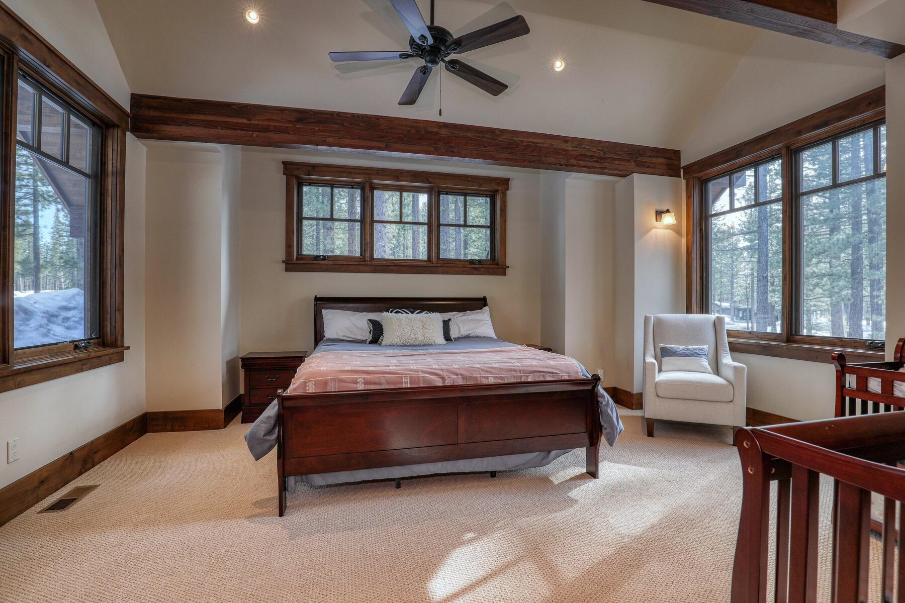 11478 Henness Road Truckee, CA 96161 - Photo 12 of 21 a bedroom with a bed and large windows