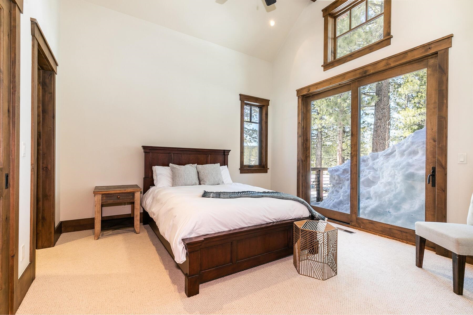 11478 Henness Road Truckee, CA 96161 - Photo 14 of 21 a large bed sitting in a bedroom next to a window