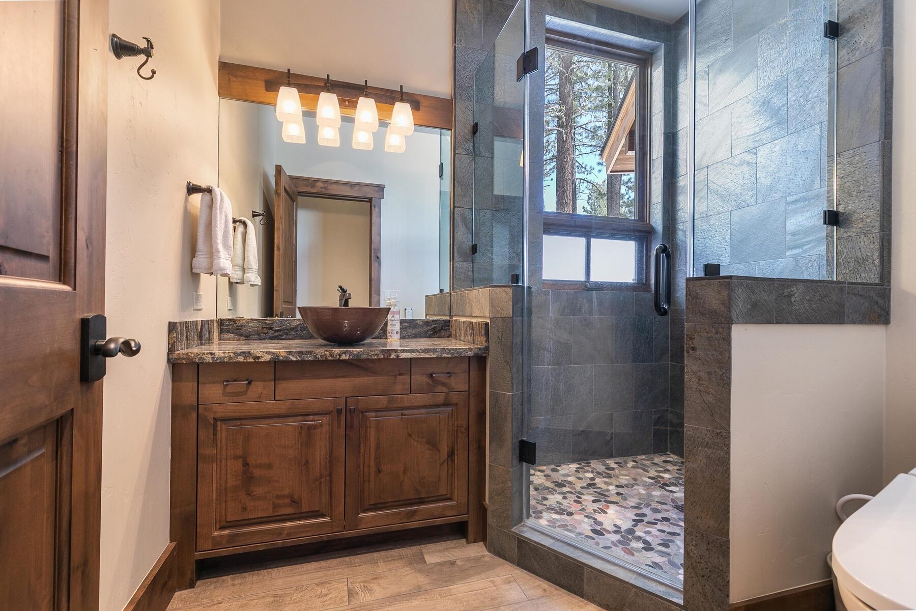 11478 Henness Road Truckee, CA 96161 - Photo 16 of 21 a bathroom with a sink a toilet and shower
