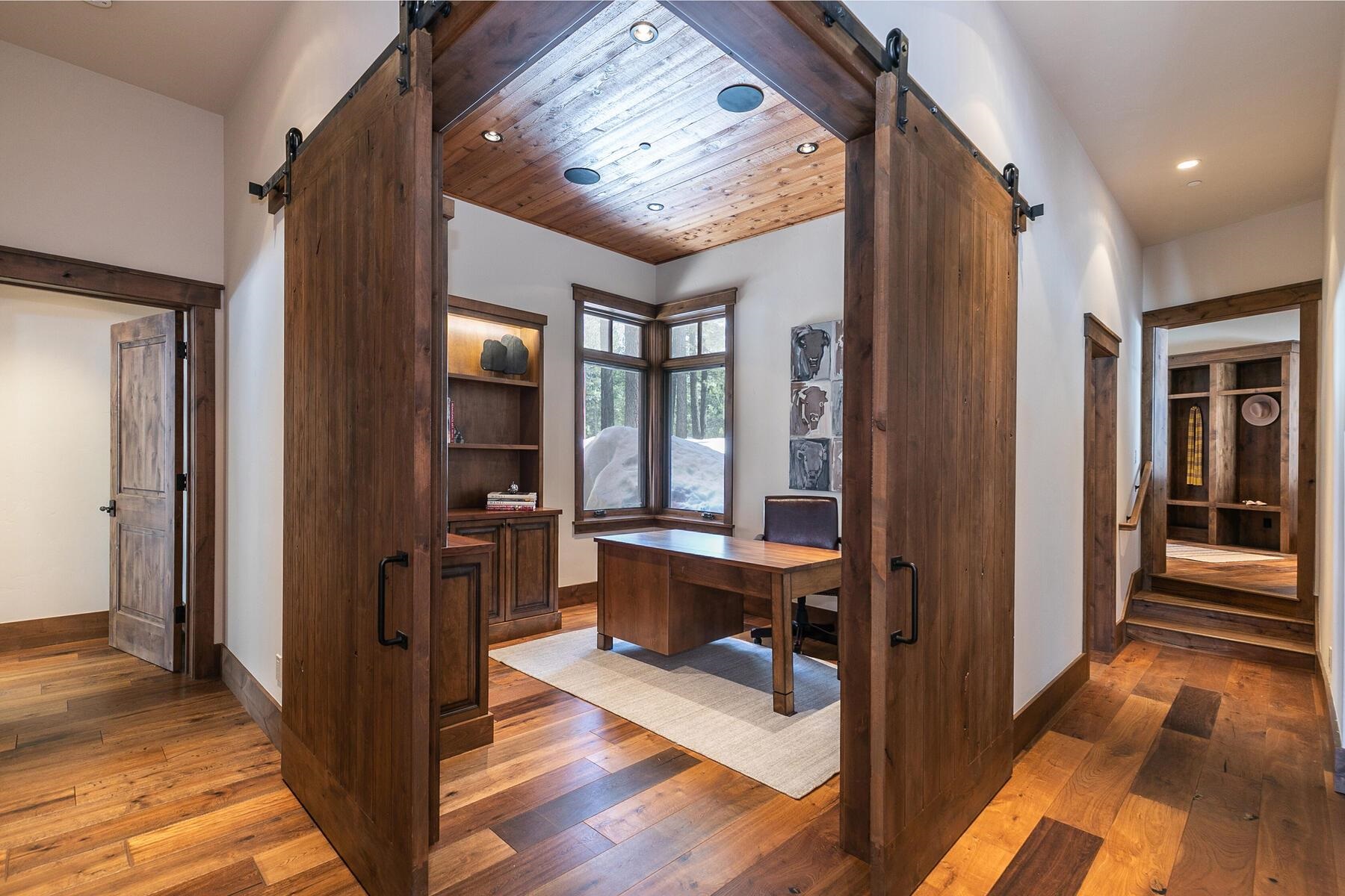 11478 Henness Road Truckee, CA 96161 - Photo 10 of 21 a view of a hallway to a livingroom with furniture and windows