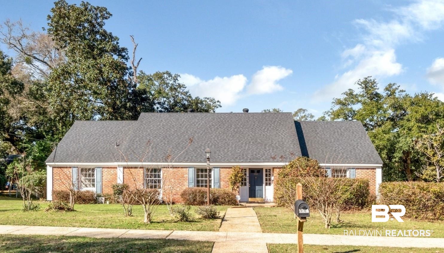 4543 Kingsway Drive Mobile, AL 36608 - Photo 1 of 28 View of front of house with a front lawn, roof with shingles, and brick siding