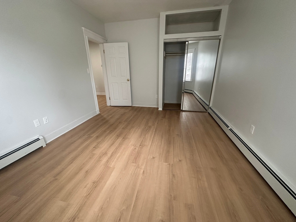 5 Crowell Street, Unit 1 Boston, MA 02124 - Photo 7 of 8 wooden floor in an empty room