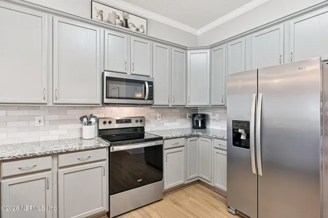 a bathroom with a tub a sink and mirrors