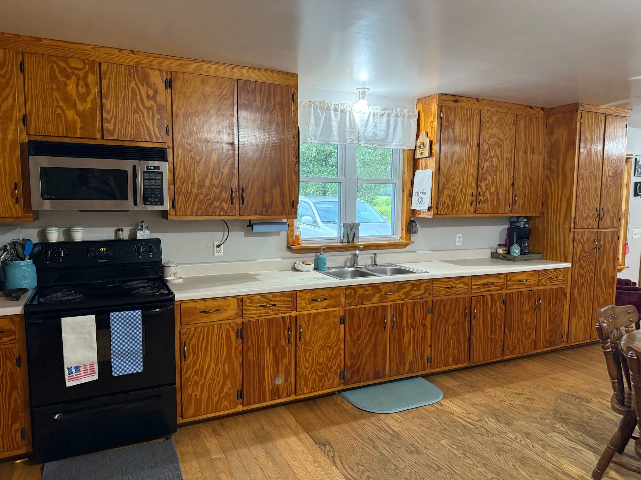2975 Bethlehem Church Road Mount Hermon, KY 42157 - Photo 5 of 72 a kitchen with granite countertop wooden cabinets stainless steel appliances a sink and a window