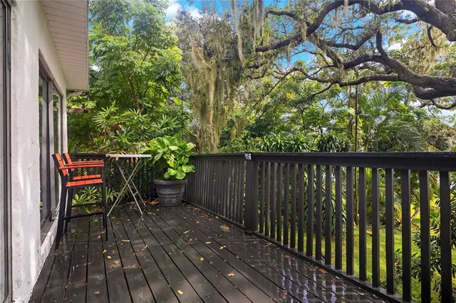 an aerial view of a house with a lake view