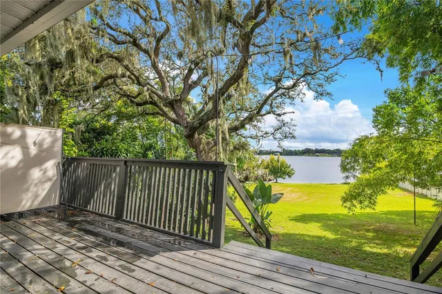 a view of outdoor space with deck and yard