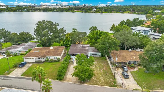 a view of a swimming pool with an outdoor seating and a yard