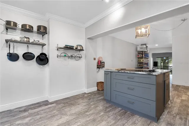 a room with a cabinets and washer