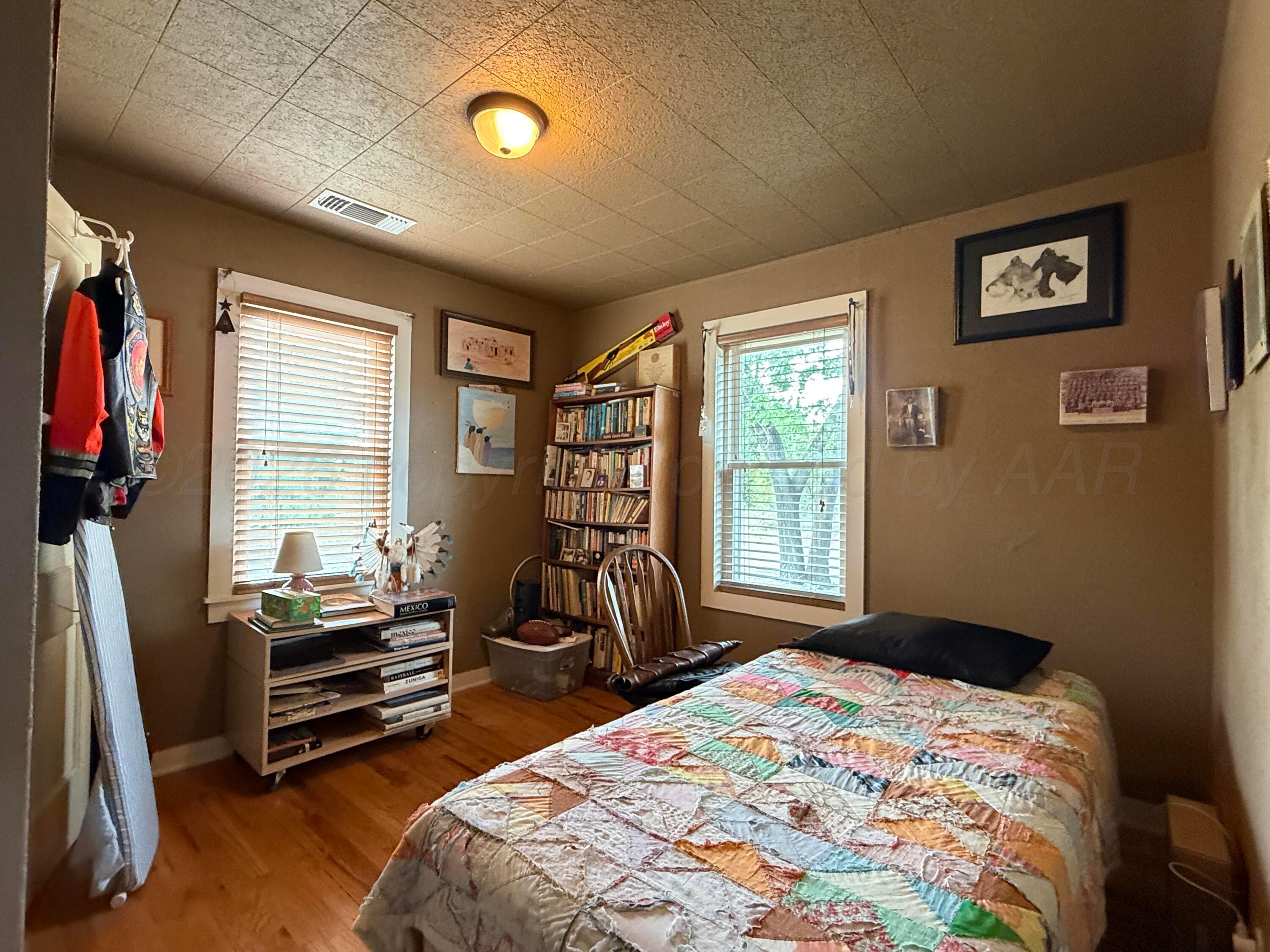 701 Brain Street Borger, TX 79007 - Photo 11 of 18 a bedroom with bed and a flat tv screen