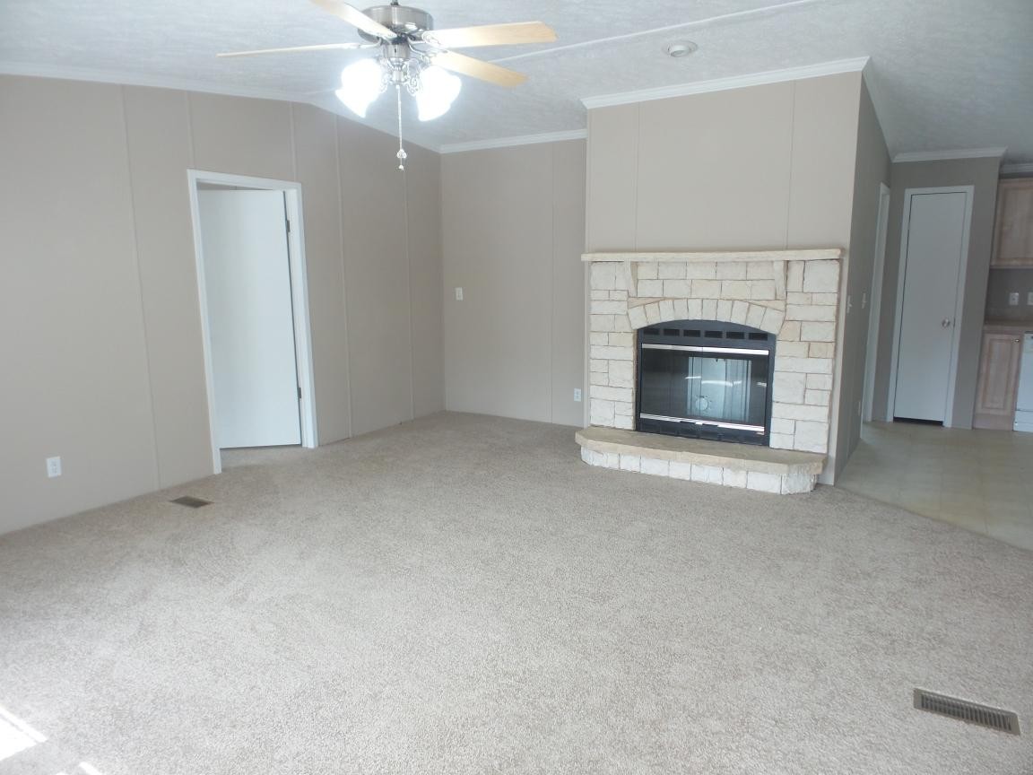 135 King Street Clinton, TN 37716 - Photo 2 of 29 a view of empty room with a fireplace