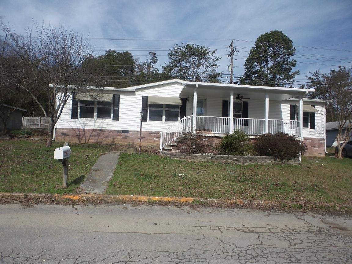 135 King Street Clinton, TN 37716 - Photo 24 of 29 a front view of a house with a yard