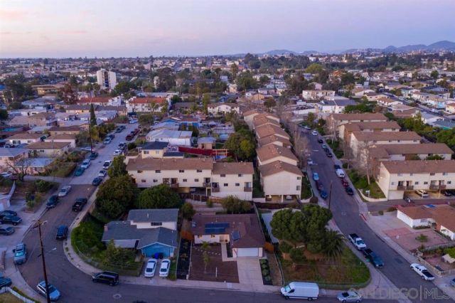 an aerial view of a city with lots of residential buildings